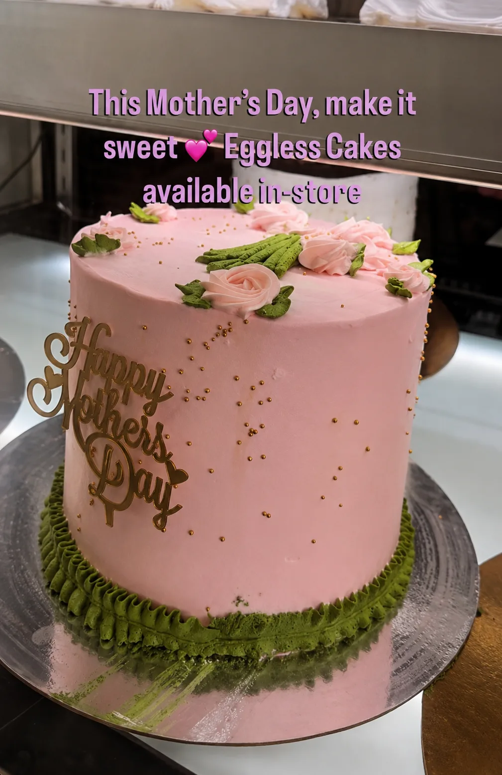 A pink Mother's Day cake with buttercream roses